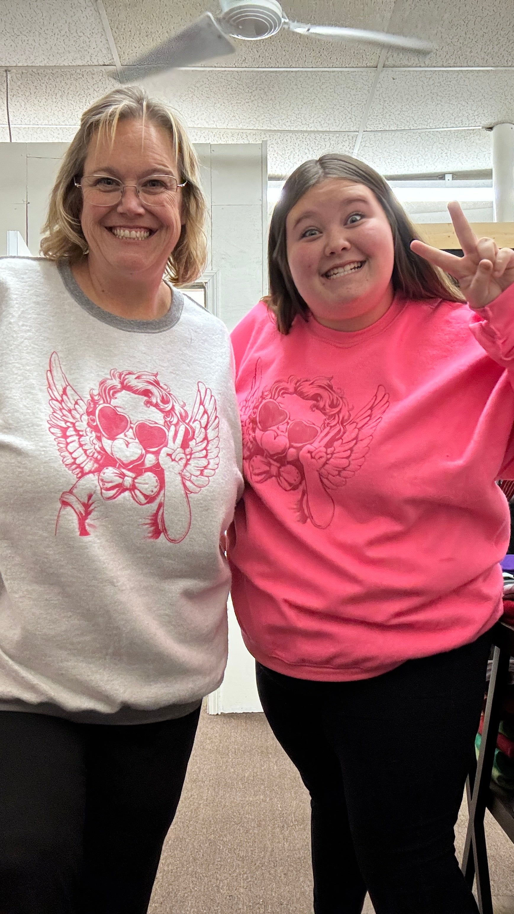 Mom and Daughter wearing cute sweatshirts
